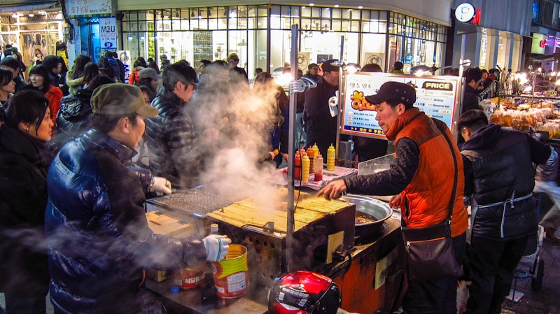 Warm and tasty street food on a cool night in Myeong-dong, Seoul