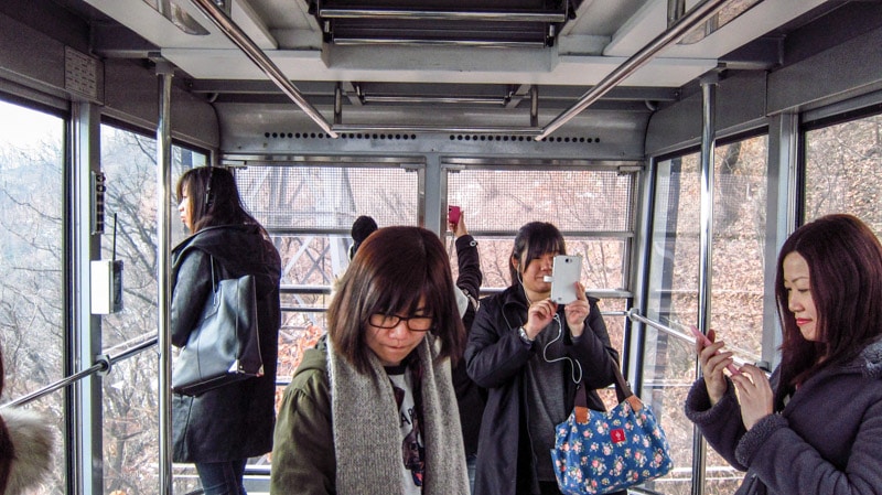 Inside the Namsan Cable Car on the way up to the N Seoul Tower