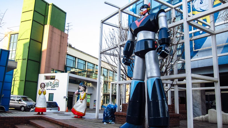 Large action figure in front of Seoul Animation Center in Seoul