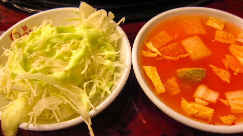 Shredded cabbage and spicy, cold soup from the self serve station