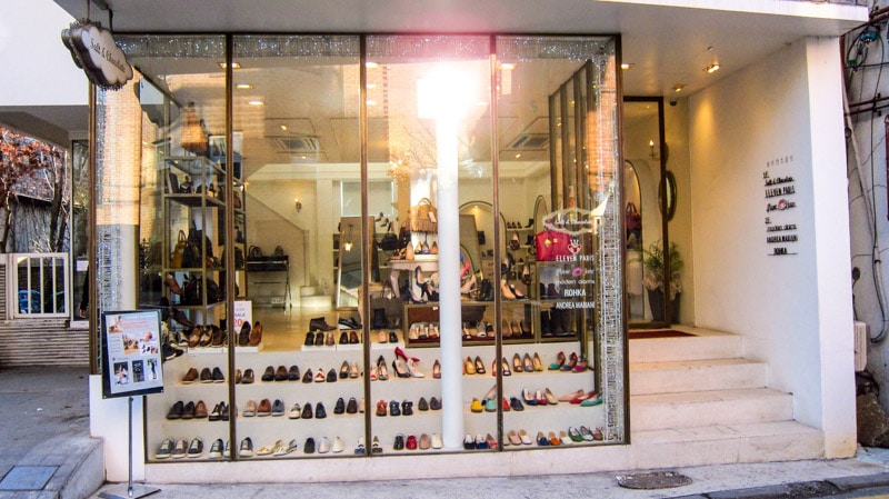 Small shops offering shoes and other fashion items on Hwagae-gil Shoes Street
