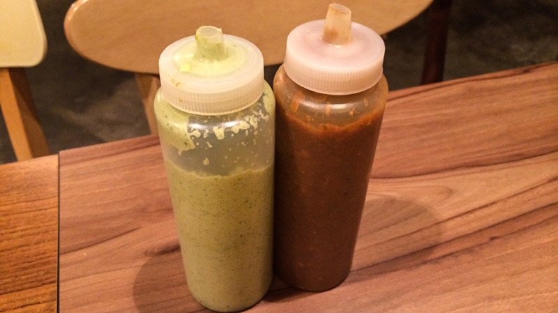 Guacamole green sauce and a smoky, red sauce