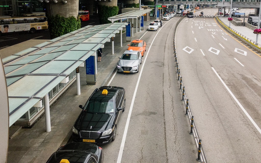 Taxis lined up outside Terminal 1 of Incheon International Airport, Seoul, Korea