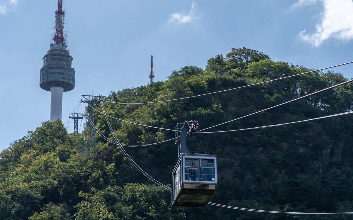 Namsan Cable Car with N Seoul Tower in the background, Seoul, Korea