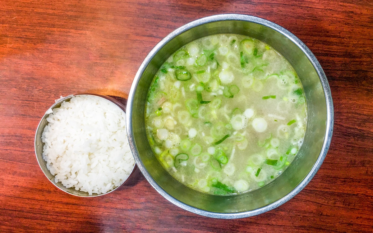 A bowl of seolleongtang with a side of rice, Seoul, Korea