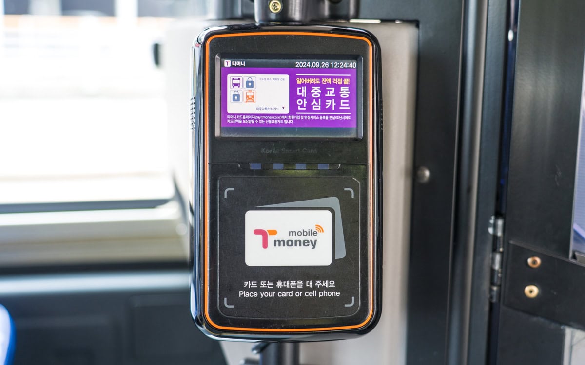 T-money card reader on a Seoul bus with a digital display and tapping area.