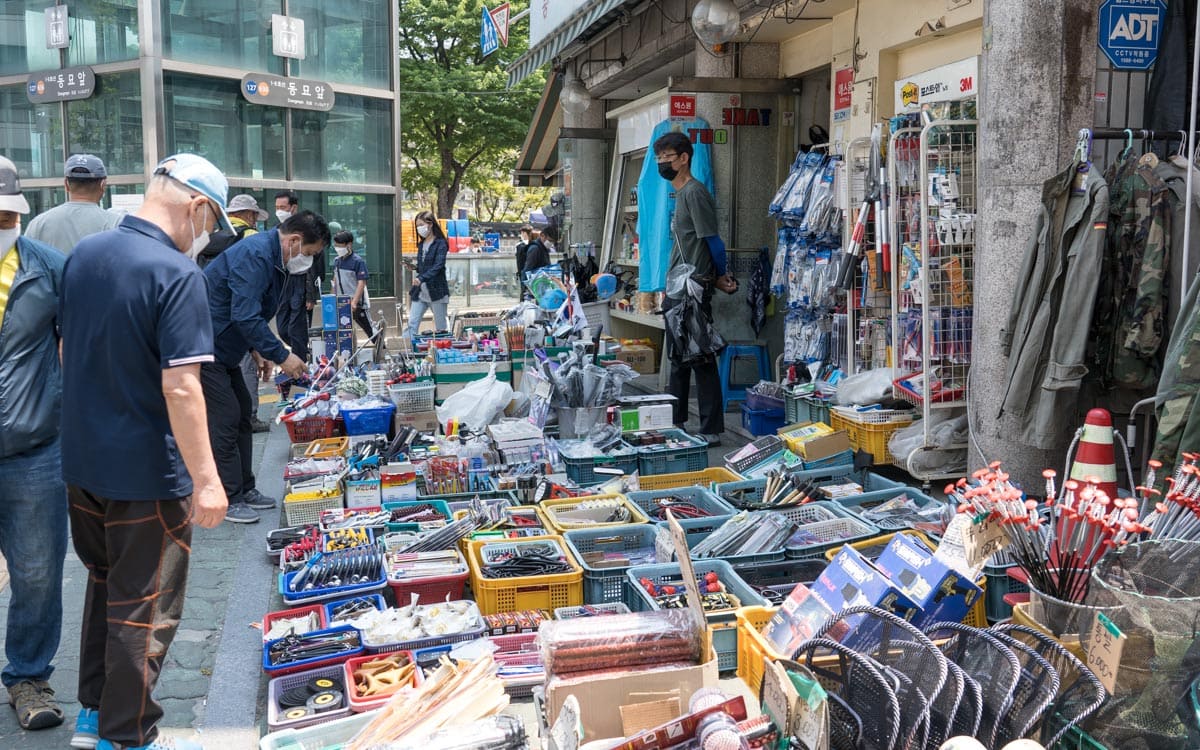 Browsing an assortment of items at Dongmyo Flea Market